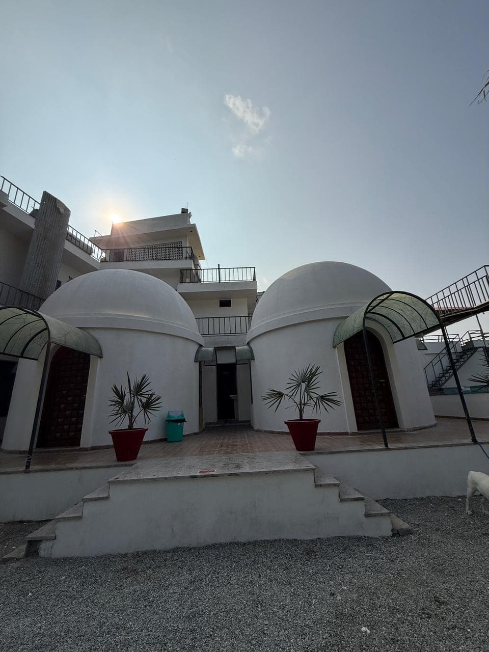 Twin dome cottages with arched canopies in daytime