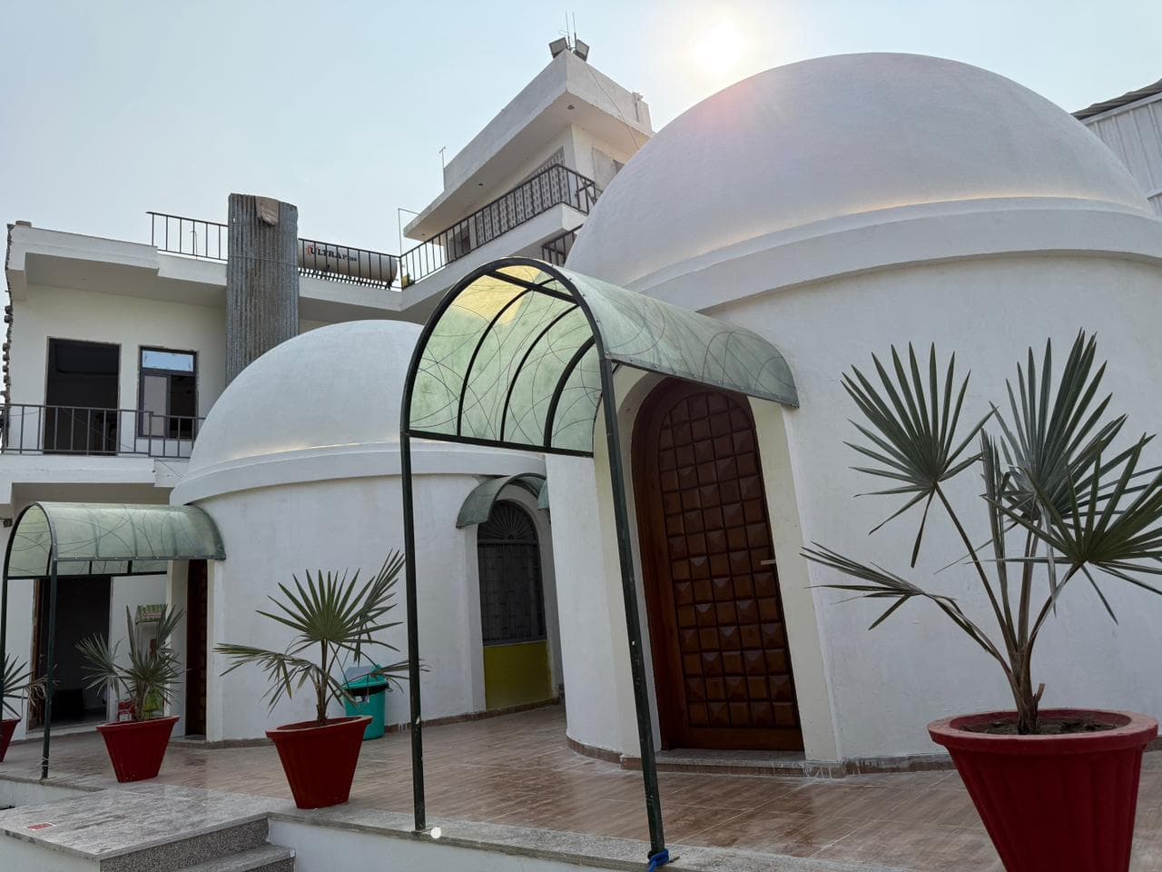 Wide view of Palm Villa dome cottages and building