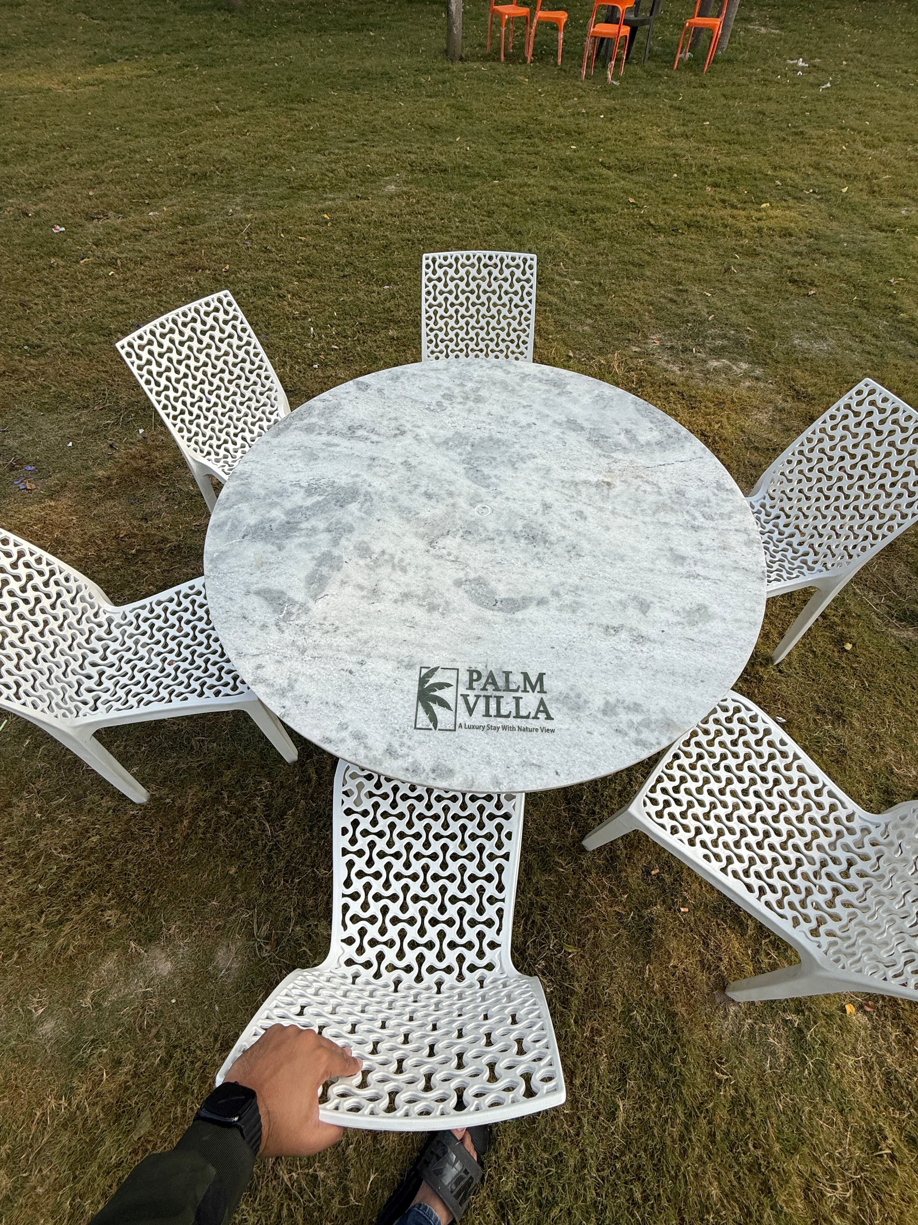 Garden seating with Palm Villa branded table