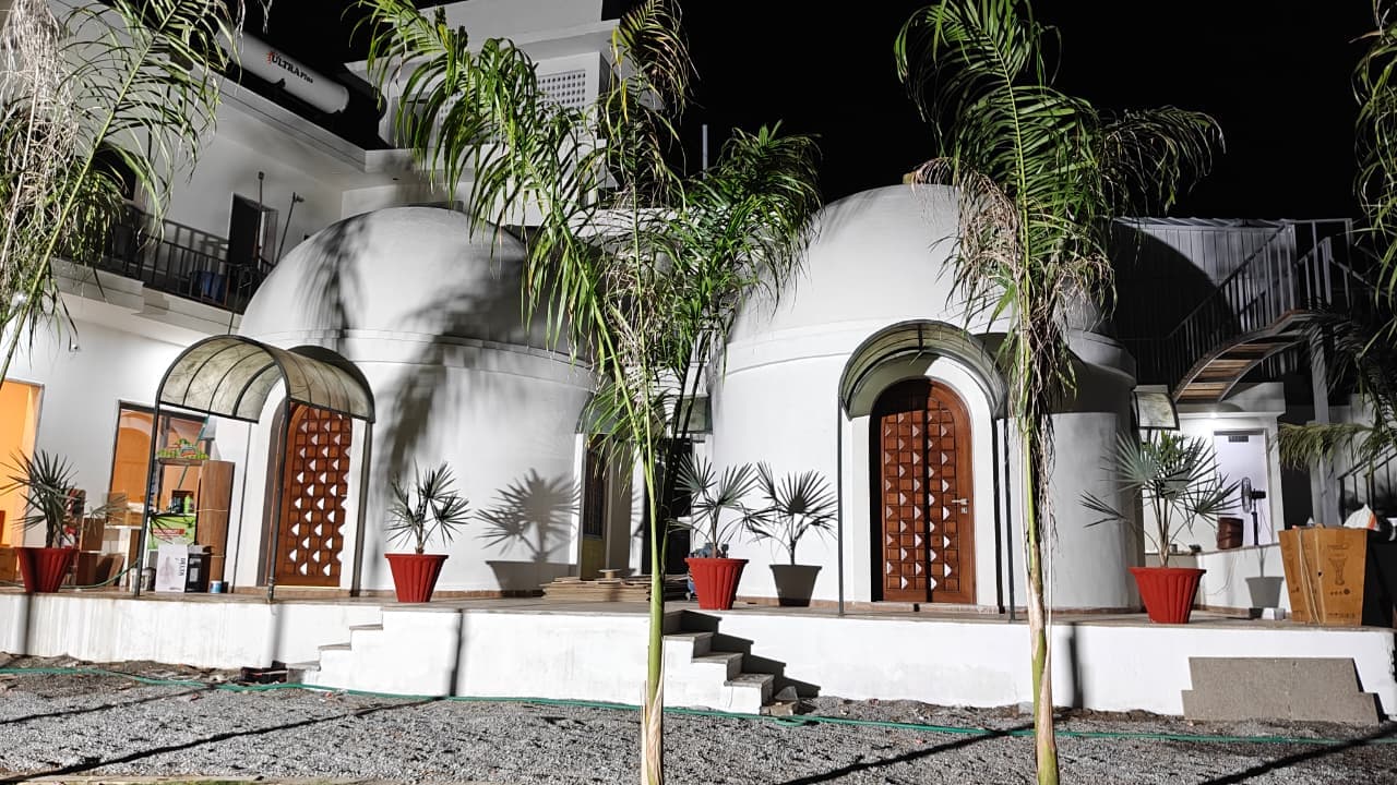 Palm Villa dome cottages at night